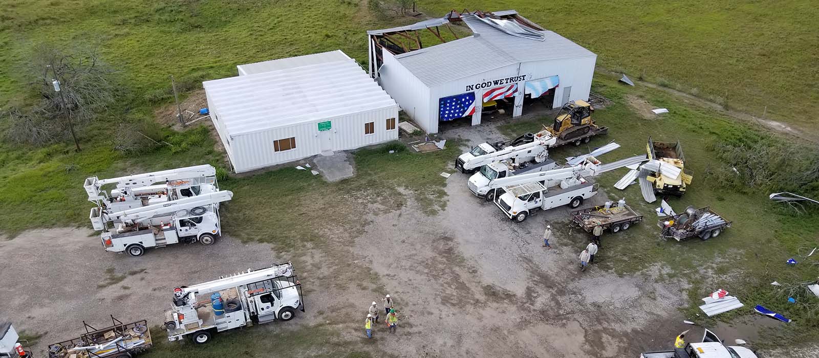 SPEC trucks at damaged Blanconia Volunteer Fire Department building